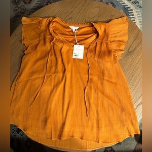 NWT Large LC Lauren Conrad Orange top with ruffled sleeves and sparkle accents.
